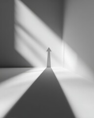 Minimalist scene with a single arrow and its shadow pointing upward, symbolizing ambition and focus.