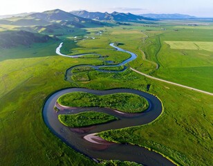 Winding river meanders through lush, green valley (1)