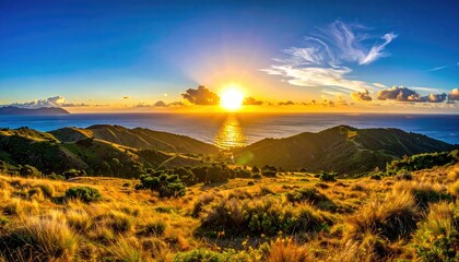 Sunburst over hills, ocean view; a peaceful landscape scene