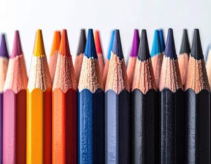 Colorful pencils lined up, sharpened tips ready for art