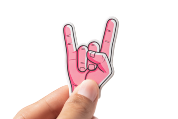 Hand holding a pink rock and roll sign