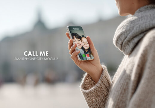 Mobile phone mockup of woman looking at screen holding phone in hands