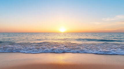 Obraz premium Golden sunrise over calm sea with gentle waves reflecting light, creating serene atmosphere