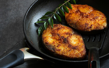  Roasted fish and potatoes, served on wooden tray, overhead, horizontal, fried fish,  grilled fish on white background.
