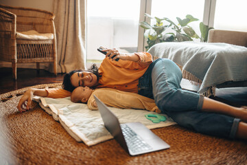 Mother and baby resting together at home
