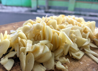 Sliced Garlic Cloves And Chips Close-Up For Cooking