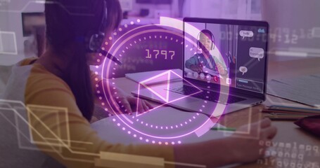 Filling notebook headset wearing child sitting at home during online call, with laptop and pencils