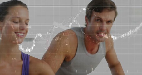 Fit couple in purple tank, grey top performing plank exercise in gym, with financial graph overlay