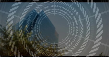 Overlaying spiral graphic tunneling toward center over city skyline, with glass tower, leafy trees
