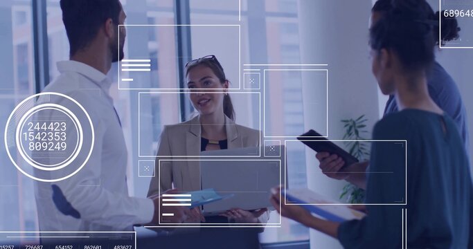 Discussing strategy team members analyzing data on laptop in modern office, with digital overlays - Powered by Adobe