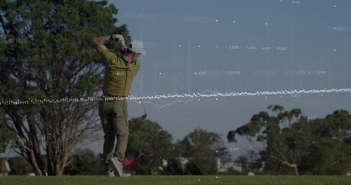 Swinging mature golfer finishing swing on fairway, with golf club, golf glove and data overlay