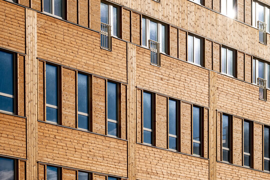 Brick apartment building with aligned windows in the district of Stora Ursvik Stockholm Sweden showing repetition and modern design