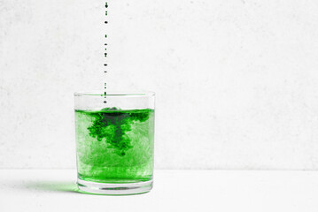 Liquid Chlorophyll Drink. Glass of Chrorophyll Water.