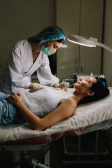 Dermatologist performs precise radio wave mole removal using radiofrequency surgery. Close-up of radio wave dermatologic mole excision. Radiofrequency mole removal under clinical conditions.