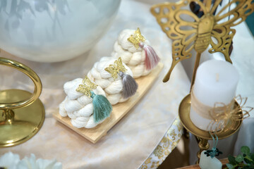 Fototapeta premium Traditional Korean first birthday (doljanchi) table decoration with cute angel figurines and pastel accessories. Elegant and symbolic dolsang setup for baby’s first birthday celebration