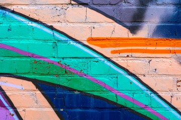 Graffiti mural with neon green, purple, orange on brick. Retro 90s, vibrant, funky, street art style. Urban backgrounds, digital art, modern 90s, 2000s, Y2K creative banner, street visuals.