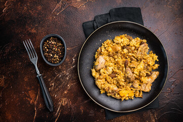 Traditional Central Asian dish Chon Kemin Valley. brown background. top view