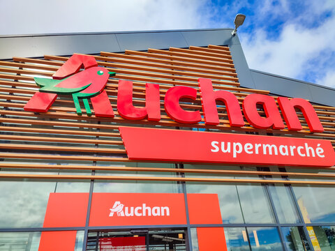 Auchan supermarket sign features vibrant logo and contemporary design elements