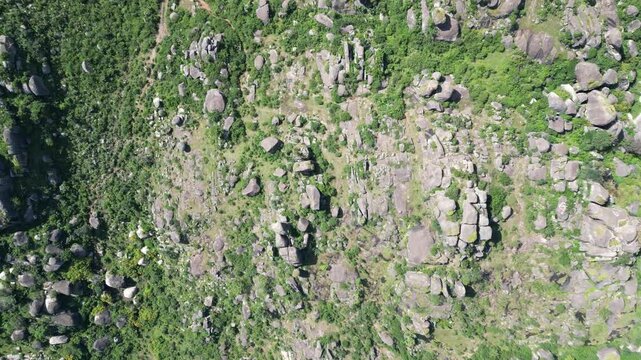 Aerial view of rugged boulder formations amongst the lush green vegetation of Shere Hills, a serene landscape, Shere Hills, Plateau, Nigeria.
