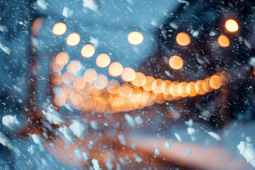 Christmas lights bokeh effect with falling snow