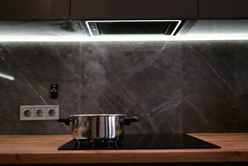 Soup boiling on electric cooktop