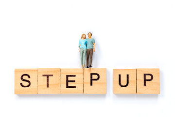 Step Up Motivation Concept with Miniature Figures