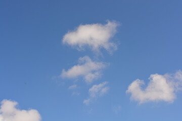 Beautiful and bright unusual nature, gentle autumn blue sky with light white clouds, big cloud, bright sun rays, sunny weather.