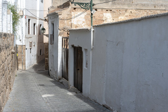 Typical architecture and narrow streets of Granada, Spain - Powered by Adobe