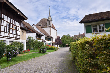 Traditional Homes with Flowers and Church in the Countryside near Zurich, Switzerland