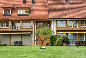 Traditional Homes with Gardens and Robotic Lawn Mower in the Countryside near Zurich, Switzerland