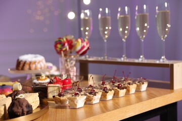 Buffet menu. Delicious desserts and drinks on table, selective focus