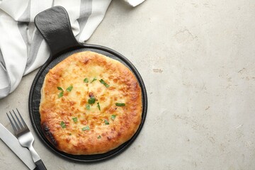 Delicious Megrelian khachapuri served on grey table, top view. Space for text