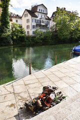 Trash Collected by a Diver from a Canal in Zurich in Front of Riverside Mansion, Switzerland