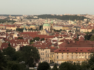 Prague cityscape featuring historic buildings and red roofs