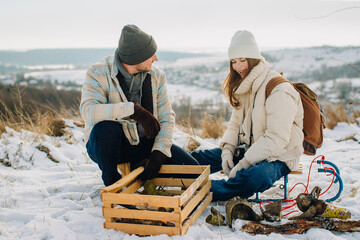 Father daughter enjoying winter day campfire