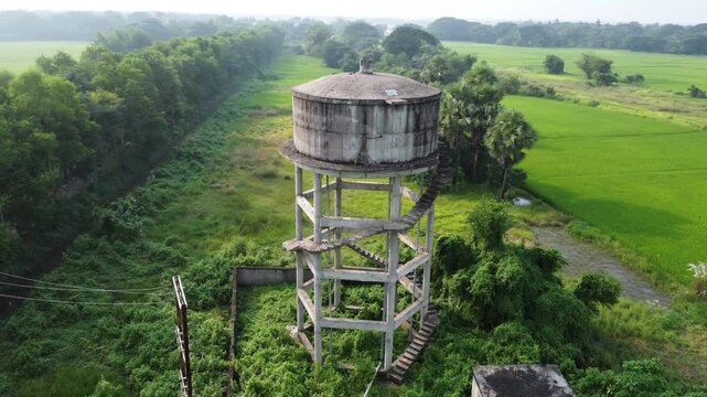 old dinking water tank in village area.
