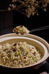 Pork fried rice,White tableware for Chinese food in a Chinese restaurant, simple composition with floral background