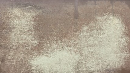 Old car paint surface with cracks, rust stains, and faded texture, showing uneven reddish-brown...