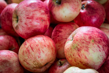 Close up of fresh red apples with natural texture and color, healthy organic fruit background