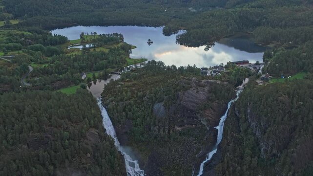 Waterfall Latefossen cascades through Norway mountain wilderness