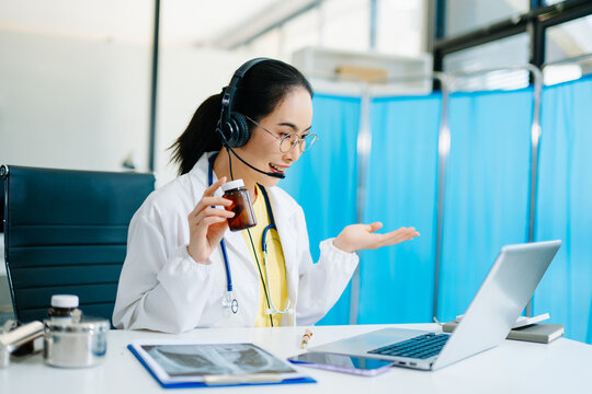 Asian female doctor analyzing data on laptop with Gantt chart overlay. Concept of healthcare planning, AI innovation, medical analytics, and real people professionalism.