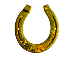 Rustic golden horseshoe rests in an upright lucky position isolated on a clean background.