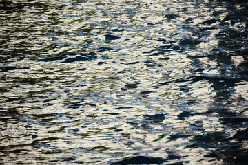 Glittering sea surface under bright sunlight.