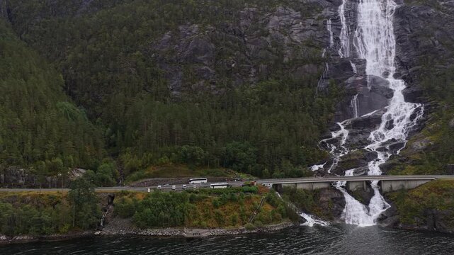 Topdown shot of Langfossen rushing through green Norwegian valley