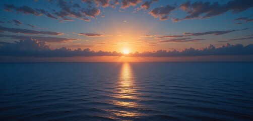 Serene ocean sunrise with gentle waves and radiant horizon under scattered clouds