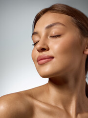 Woman with closed eyes feeling calm confidence and natural glow of healthy beauty. Concept of self-acceptance, inner peace, professional skincare and cosmetic advertising. © Lustre Art Group 