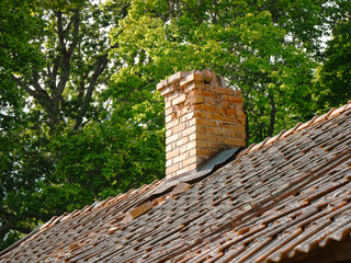 An old broken brick chimney