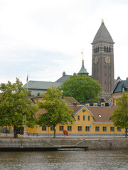 Fototapeta premium Buildings by river in city