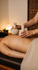 Caucasian woman enjoying herbal compress massage. Spa therapy for relaxation and wellness. Traditional thai treatment in a resort.