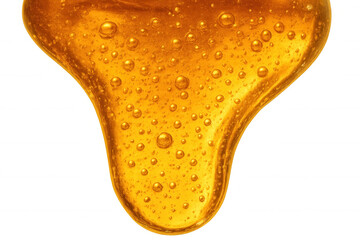 Golden honey dripping down with air bubbles, sweet natural syrup close up. Liquid food ingredient on transparent background